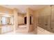Bright main bathroom features a soaking tub, walk-in shower, and double vanity at 15101 Kestrelglen Way, Lithia, FL 33547