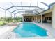 A screened-in pool and spa offer the perfect space for outdoor relaxation and entertainment at 15101 Kestrelglen Way, Lithia, FL 33547