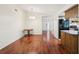 Dining room featuring hardwood floors adjacent to kitchen and entryway at 166 11Th N Ave, Safety Harbor, FL 34695
