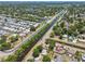 An aerial view showcases a residential area with a canal running through the center at 1810 77Th N Ave, St Petersburg, FL 33702