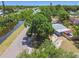This beautiful property offers a relaxing setting next to a tranquil canal and surrounded by mature, shady trees at 1810 77Th N Ave, St Petersburg, FL 33702
