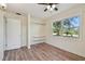 Bedroom with a ceiling fan, a small closet, and a large window at 1810 77Th N Ave, St Petersburg, FL 33702