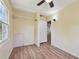 Inviting bedroom with wood-look floors, closet, window, and ceiling fan at 1810 77Th N Ave, St Petersburg, FL 33702