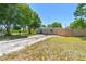 A well-maintained home features mature shade trees in the yard, enhancing its curb appeal in a quiet neighborhood at 1810 77Th N Ave, St Petersburg, FL 33702