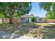 Inviting single-Gathering home featuring a well-kept lawn, decorative window details, and a white front door at 1810 77Th N Ave, St Petersburg, FL 33702