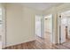 Bright hallway with wood-look flooring and many doorways at 1810 77Th N Ave, St Petersburg, FL 33702