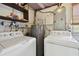Functional laundry room with washer, dryer, and storage space at 1810 77Th N Ave, St Petersburg, FL 33702
