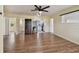Inviting living room with vinyl plank floors, ceiling fan, and views of the kitchen and bathroom at 1810 77Th N Ave, St Petersburg, FL 33702