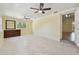 Spacious living room with tile floors, ceiling fans, and natural light at 1810 77Th N Ave, St Petersburg, FL 33702