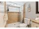 Bathroom featuring granite vanity, updated fixtures, and tile shower with patterned shower curtain at 1818 Indian Rocks Rd S, Largo, FL 33774