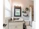 Updated bathroom features a granite vanity, modern fixtures, and a walk-in shower at 1818 Indian Rocks Rd S, Largo, FL 33774