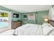 Bright bedroom with a sliding glass door that leads to a pool at 1818 Indian Rocks Rd S, Largo, FL 33774