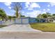 Charming one-story home with a two-car garage, well-maintained lawn and mature trees in a quiet neighborhood at 1818 Indian Rocks Rd S, Largo, FL 33774