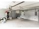 Attached garage featuring laundry area and door to interior of home at 1818 Indian Rocks Rd S, Largo, FL 33774