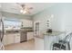 Bright kitchen features granite counters, stainless appliances, and a breakfast bar with seating at 1818 Indian Rocks Rd S, Largo, FL 33774