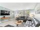 Cozy living room featuring modern decor, ample seating, and great natural light, enhancing its warm and inviting atmosphere at 1818 Indian Rocks Rd S, Largo, FL 33774