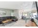 Open living area with seamless flow to the dining space, features modern decor, light floors and comfortable furnishings at 1818 Indian Rocks Rd S, Largo, FL 33774