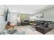 Bright living room with comfortable seating, natural light, and a charming ambiance perfect for relaxation and entertaining at 1818 Indian Rocks Rd S, Largo, FL 33774