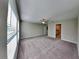 Neutral bedroom featuring an ensuite bathroom, closet and ceiling fan at 1881 Colding Dr, Ruskin, FL 33570