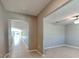 Hallway features a ceiling fan and tile flooring at 1881 Colding Dr, Ruskin, FL 33570