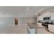 Open kitchen featuring a large island with a sink, granite countertops, and stainless steel appliances at 1881 Colding Dr, Ruskin, FL 33570