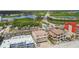 Captivating aerial of a multi-story beachfront property, conveniently located near the bridge and scenic surroundings at 19010 Gulf Blvd # 203, Indian Shores, FL 33785