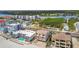 Aerial view of beachside condos with pools and balconies, offering stunning water views at 19010 Gulf Blvd # 203, Indian Shores, FL 33785