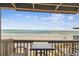 Beach view from private balcony with outdoor dining, seating area and ocean breezes at 19010 Gulf Blvd # 203, Indian Shores, FL 33785