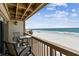 Inviting balcony with seating overlooks the beach and ocean views at 19010 Gulf Blvd # 203, Indian Shores, FL 33785