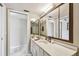 Spacious bathroom vanity with large mirror and walk-in shower at 19010 Gulf Blvd # 203, Indian Shores, FL 33785