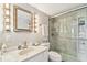 Modern bathroom featuring a glass-enclosed shower and marble countertop vanity at 19010 Gulf Blvd # 203, Indian Shores, FL 33785