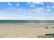 Expansive white sand beach with calm waves perfect for a relaxing vacation at 19010 Gulf Blvd # 203, Indian Shores, FL 33785