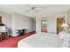 Bedroom with carpet flooring and access to a private bathroom and balcony at 19010 Gulf Blvd # 203, Indian Shores, FL 33785