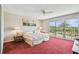Bright bedroom with sliding glass doors leading to a private balcony at 19010 Gulf Blvd # 203, Indian Shores, FL 33785