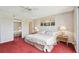 Bedroom with mirrored closet doors, ceiling fan, and natural light at 19010 Gulf Blvd # 203, Indian Shores, FL 33785