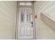 Elegant condo front door with decorative glass panels and secure entry system at 19010 Gulf Blvd # 203, Indian Shores, FL 33785