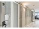 Bright condo hallway with marble floors, ample closet space, and modern lighting at 19010 Gulf Blvd # 203, Indian Shores, FL 33785
