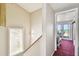 Hallway leading to a sunroom with sliding glass doors that provide access to a spacious outdoor patio at 19010 Gulf Blvd # 203, Indian Shores, FL 33785