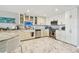 Modern kitchen with stainless steel appliances and an artistic backsplash window above the sink at 19010 Gulf Blvd # 203, Indian Shores, FL 33785