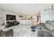 Open floorplan featuring kitchen with island, living room with marble floors, fireplace and ocean view at 19010 Gulf Blvd # 203, Indian Shores, FL 33785