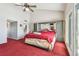Spacious main bedroom with high ceiling, ceiling fan, and an en-suite bathroom at 19010 Gulf Blvd # 203, Indian Shores, FL 33785