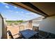 Spacious outdoor deck with a dining table and views of the surrounding area at 19010 Gulf Blvd # 203, Indian Shores, FL 33785