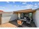 Outdoor deck with patio table, chairs, and slider access to interior living space at 19010 Gulf Blvd # 203, Indian Shores, FL 33785
