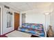 Comfortable sunroom with futon seating and plenty of light from nearby windows and a door to the hallway at 19010 Gulf Blvd # 203, Indian Shores, FL 33785