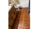 Bathroom featuring a vanity, toilet, and bathtub with red brick floor at 213 Mahogany Dr, Seffner, FL 33584