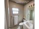 Modern bathroom with stylish fixtures, white tiling, and a sleek vanity at 213 Mahogany Dr, Seffner, FL 33584
