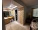 Bathroom featuring wallpaper, vanity, and access to the closet at 213 Mahogany Dr, Seffner, FL 33584