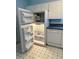 The kitchen includes white cabinets, a dishwasher, and a refrigerator at 213 Mahogany Dr, Seffner, FL 33584
