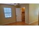 Bedroom featuring a window with blinds, hardwood floors, and closet at 2615 Southern Oaks Pl, Plant City, FL 33566