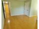 This bright bedroom features hardwood floors and neutral wall colors at 2615 Southern Oaks Pl, Plant City, FL 33566